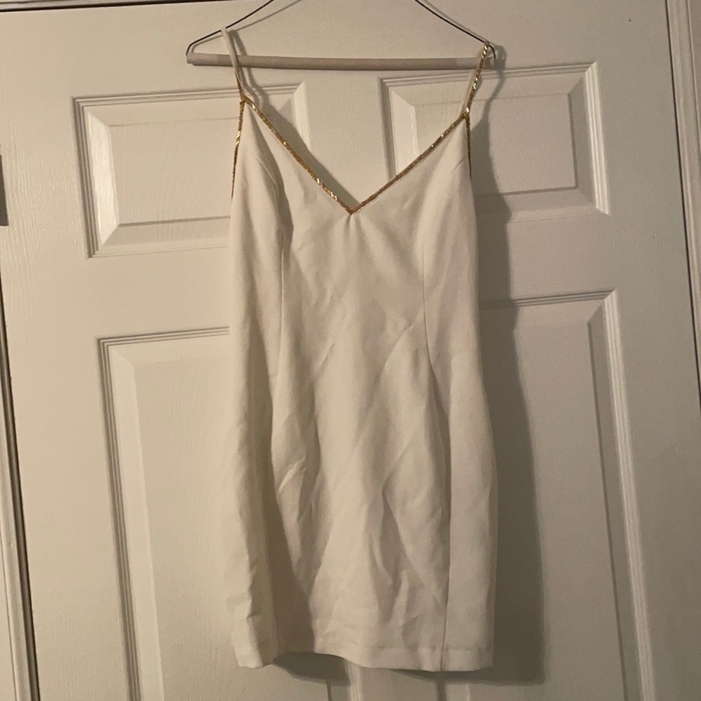 White dress with gold embellishments